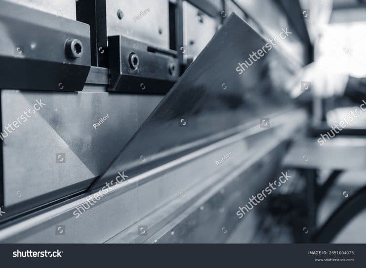 stock-photo-close-up-of-sheet-metal-bending-in-industrial-factory-2651004073.jpg