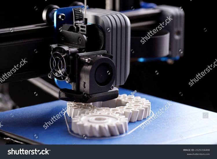 stock-photo-gantry-with-x-carriage-and-print-head-of-a-fdm-d-printer-that-produces-white-helical-gears-on-blue-2125316408.jpg