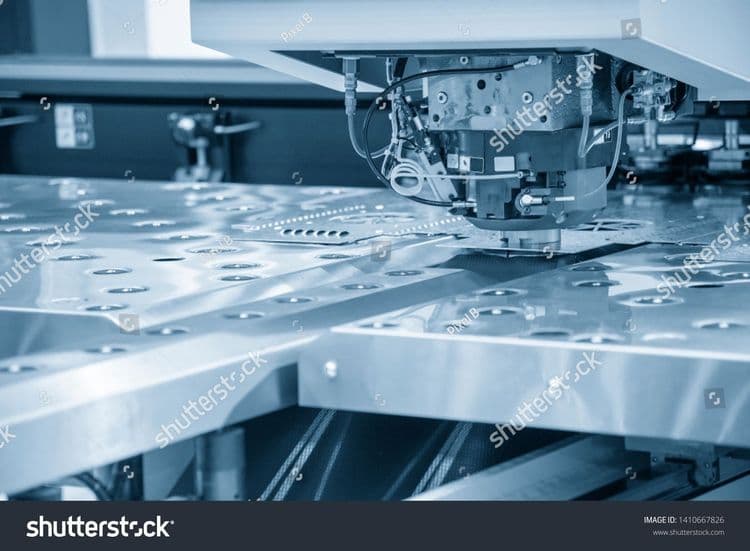 stock-photo-turret-punching-machine-cutting-the-metal-plate-metal-forming-machine-1410667826.jpg